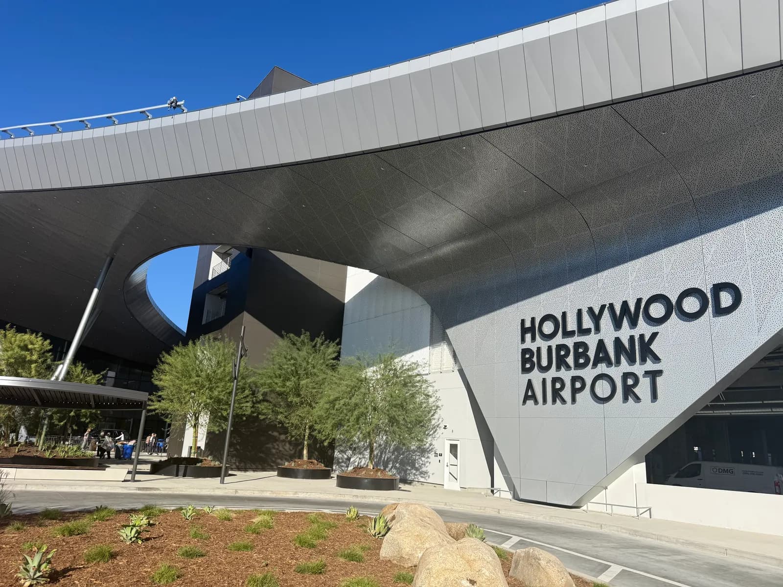 Hollywood Burbank Airport terminal exterior with the airport name sign
